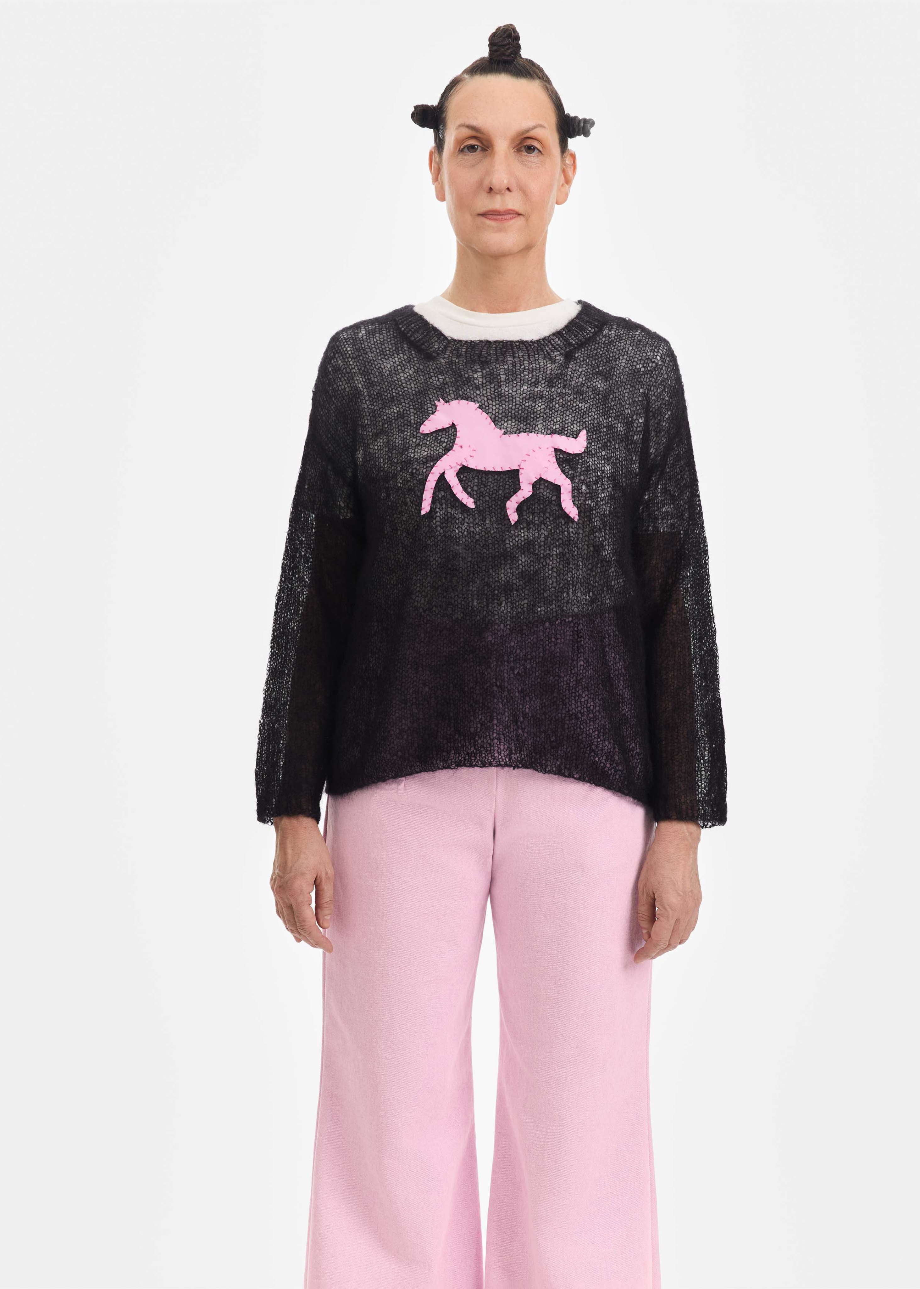 Black sweater, pink pony patch