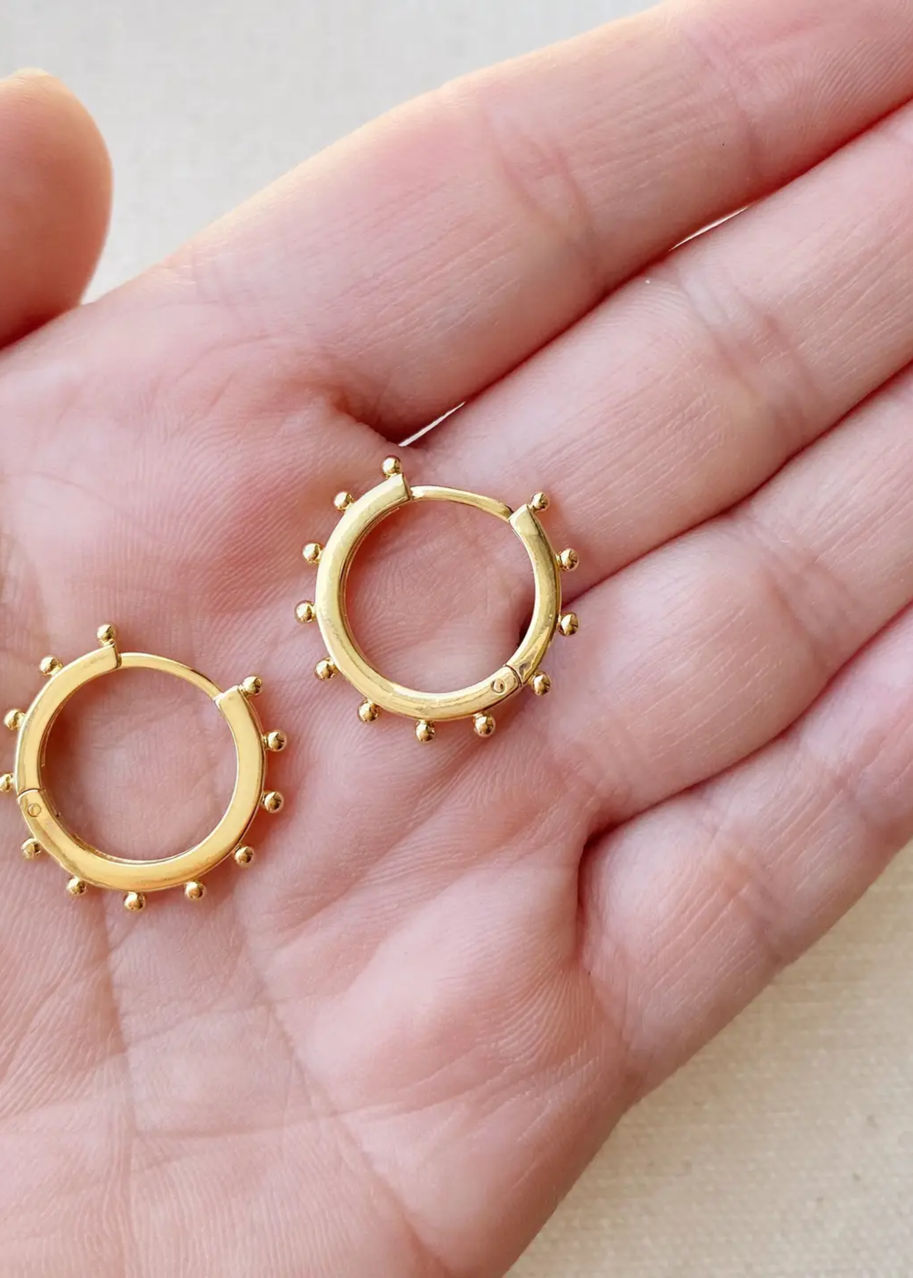 Hoop earrings with ball detail