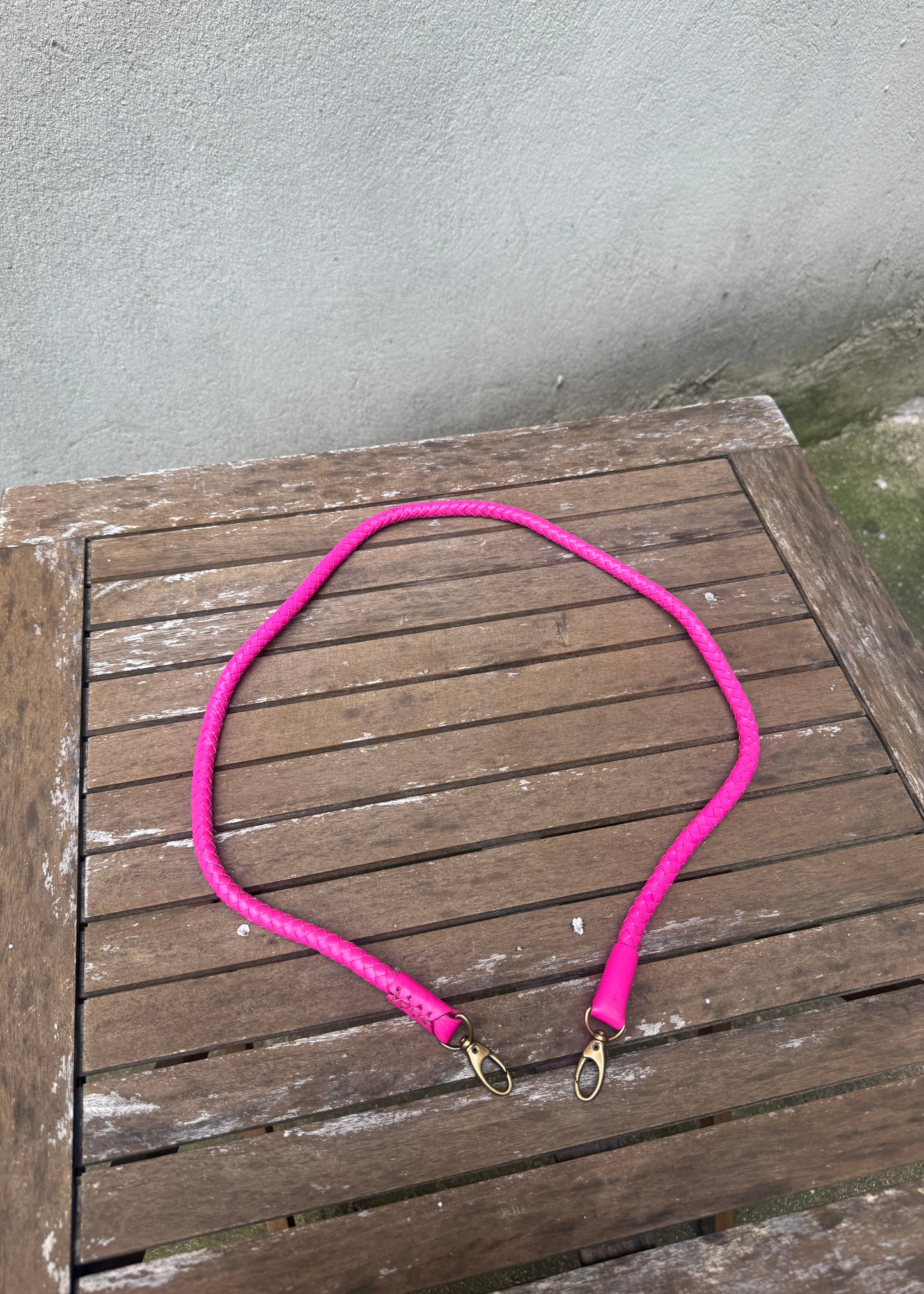 Metallic pink hand-braided leather strap