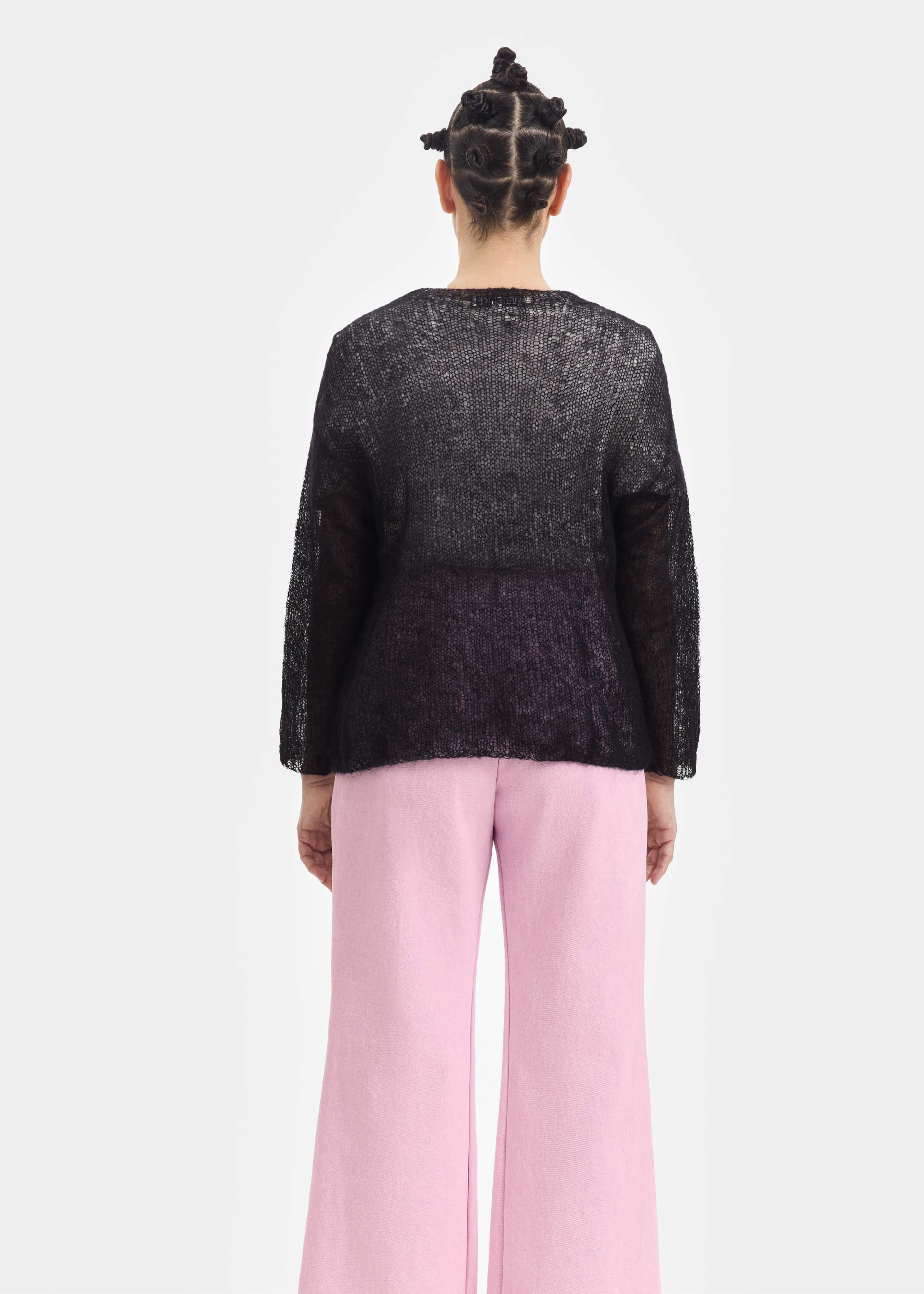 Black sweater, pink pony patch