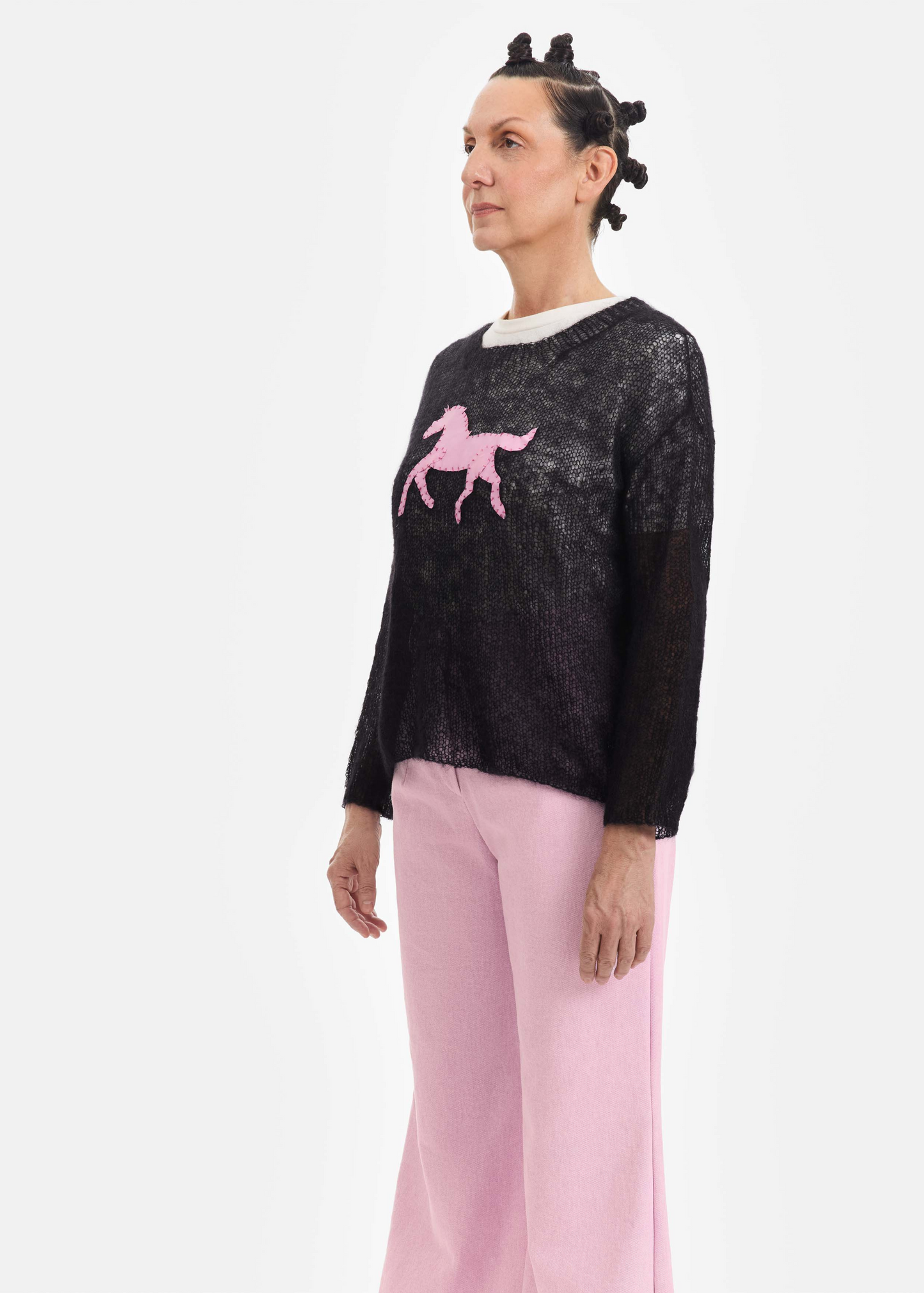 Black sweater, pink pony patch